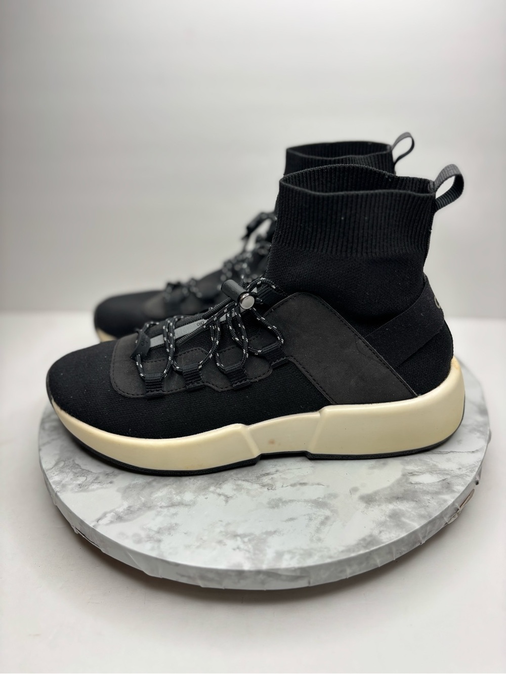 Size 7-  Alo Yoga Women's Wanderer Sneaker in black with a high-top sock-knit